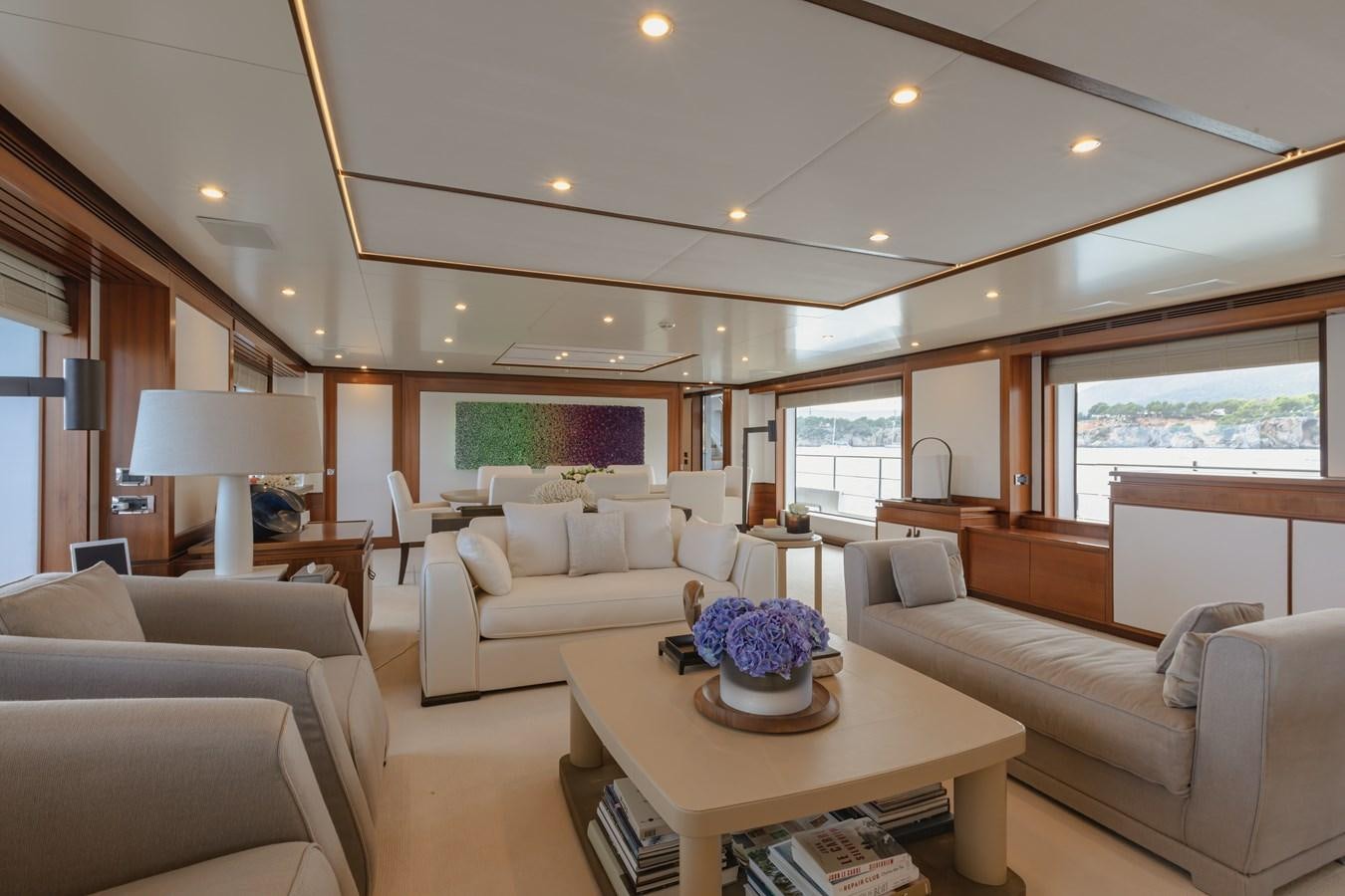 a living room with a couch and a coffee table aboard NEW WAVES Yacht for Sale
