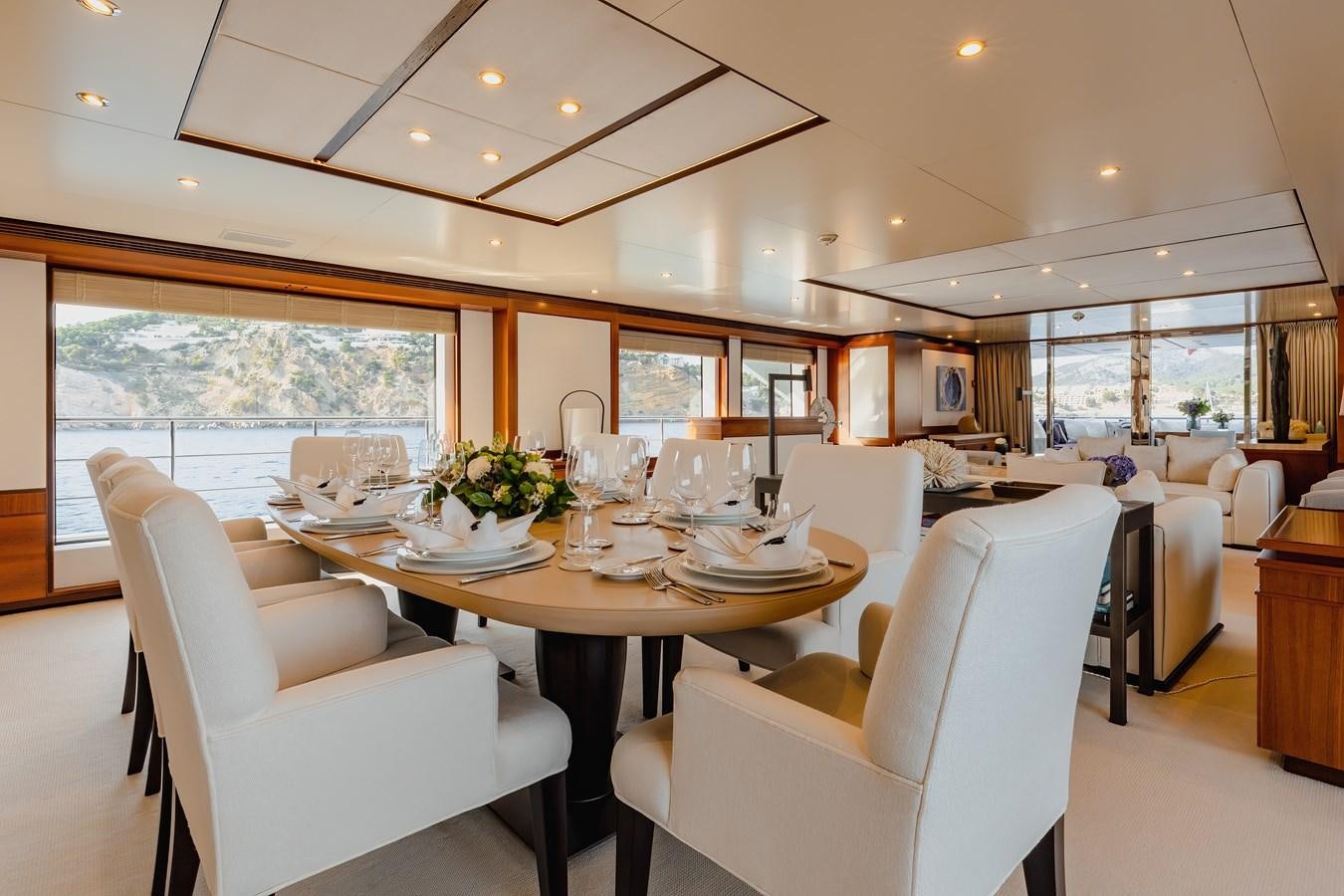 a dining room with a table and chairs aboard NEW WAVES Yacht for Sale