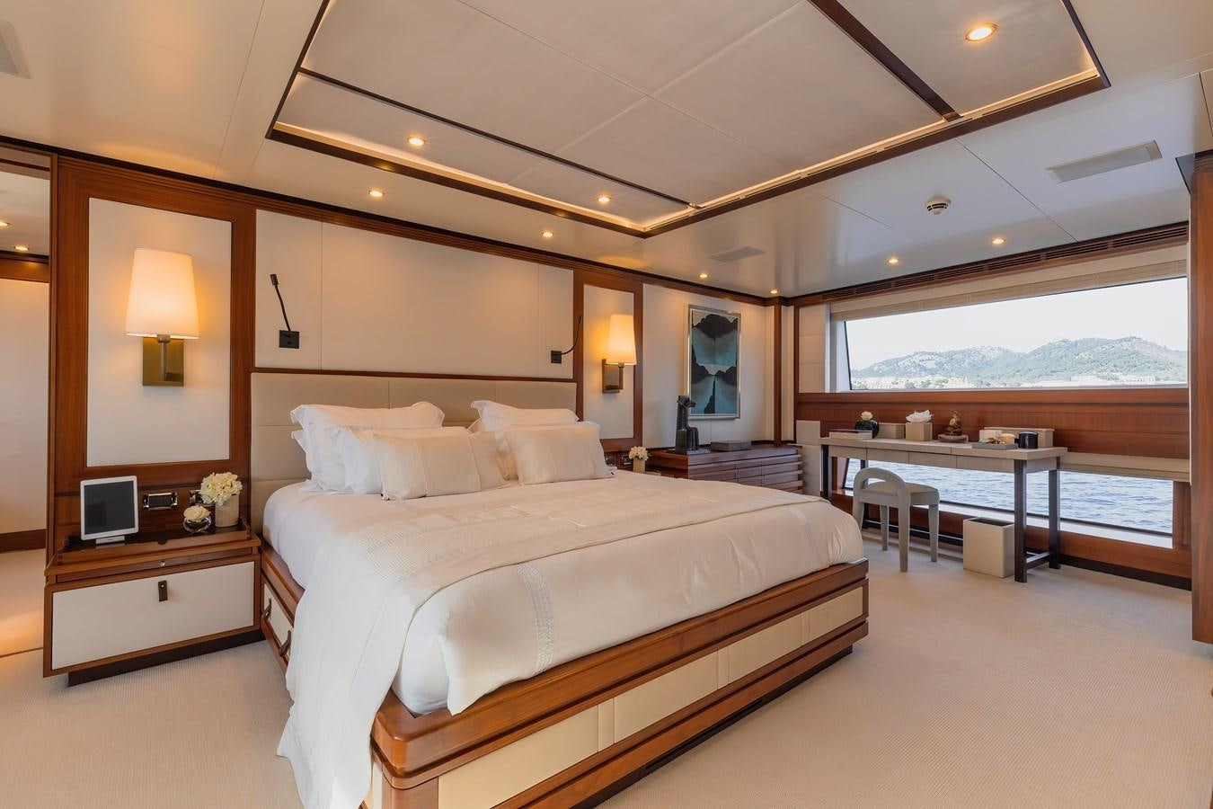 a hotel room with a large bed aboard NEW WAVES Yacht for Sale