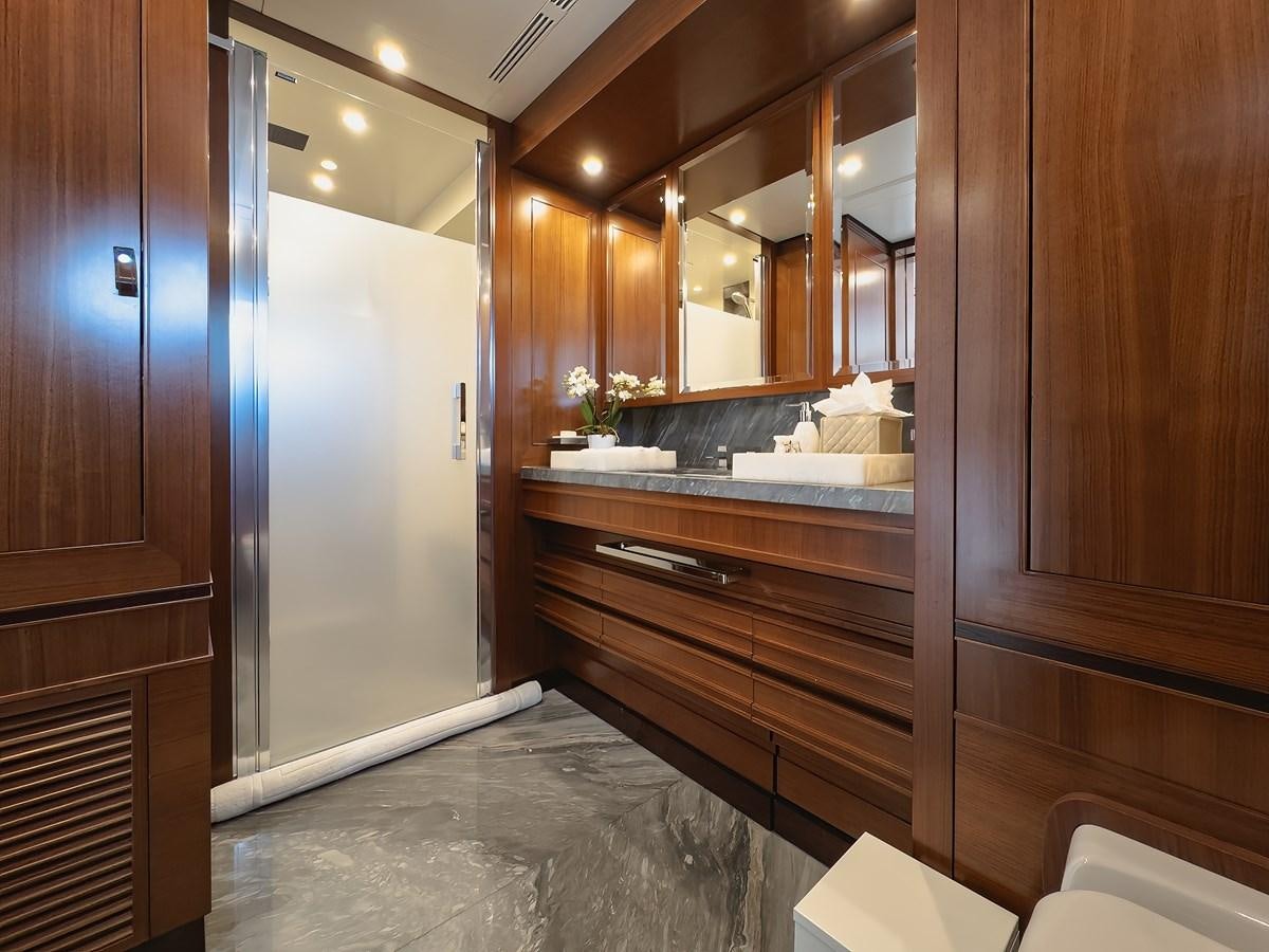 a bathroom with a large mirror aboard NEW WAVES Yacht for Sale