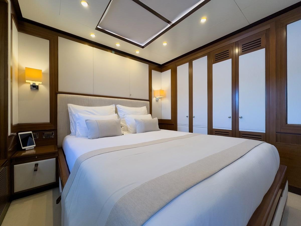 a bed in a hotel room aboard NEW WAVES Yacht for Sale