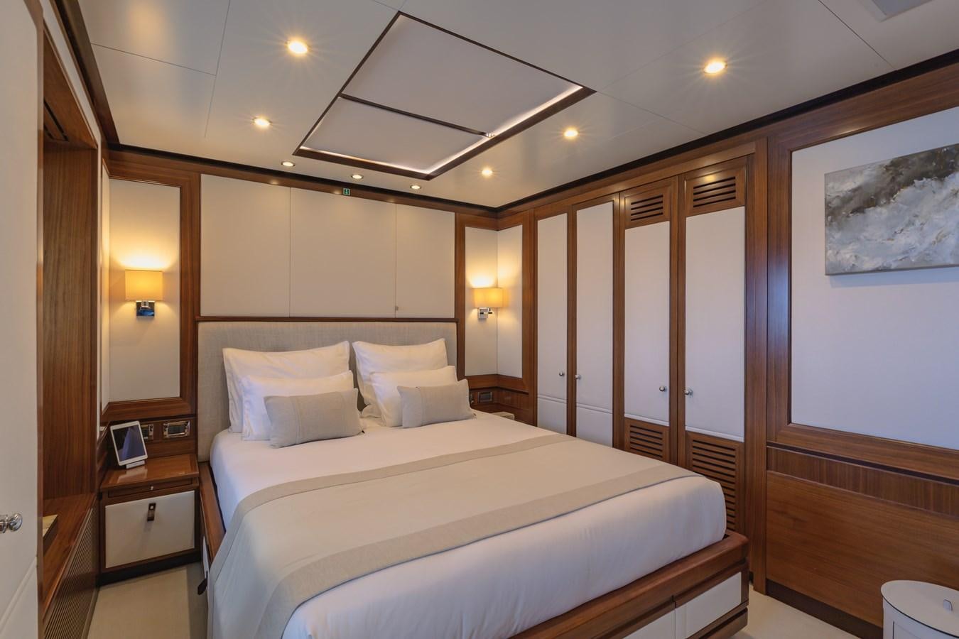 a hotel room with a bed aboard NEW WAVES Yacht for Sale
