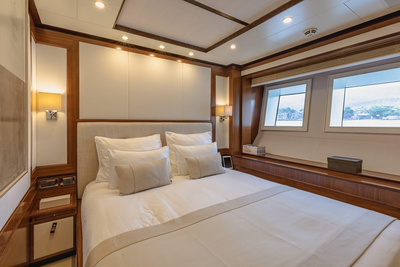 a bed with a white sheet aboard NEW WAVES Yacht for Sale