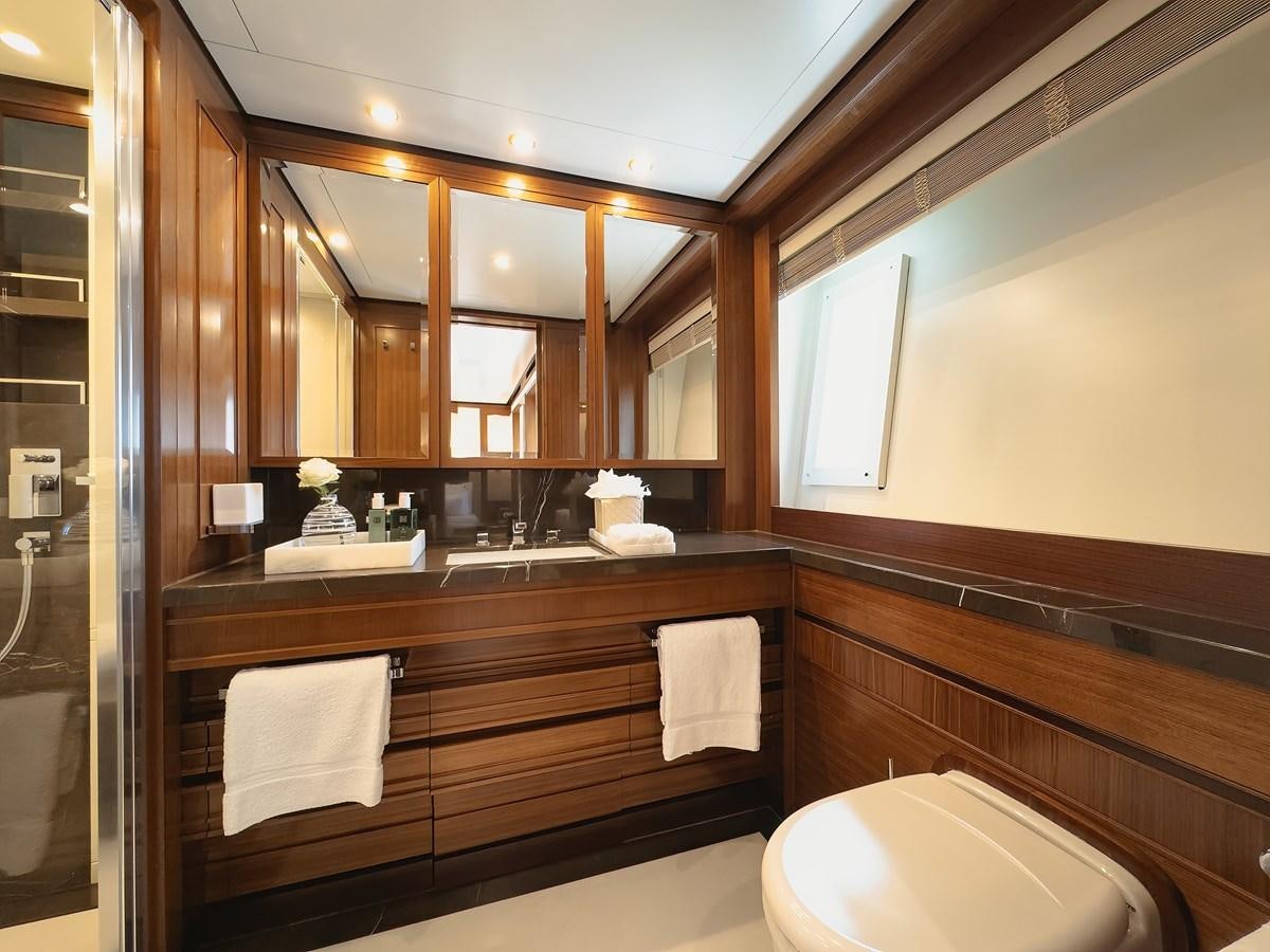 a bathroom with a large mirror aboard NEW WAVES Yacht for Sale