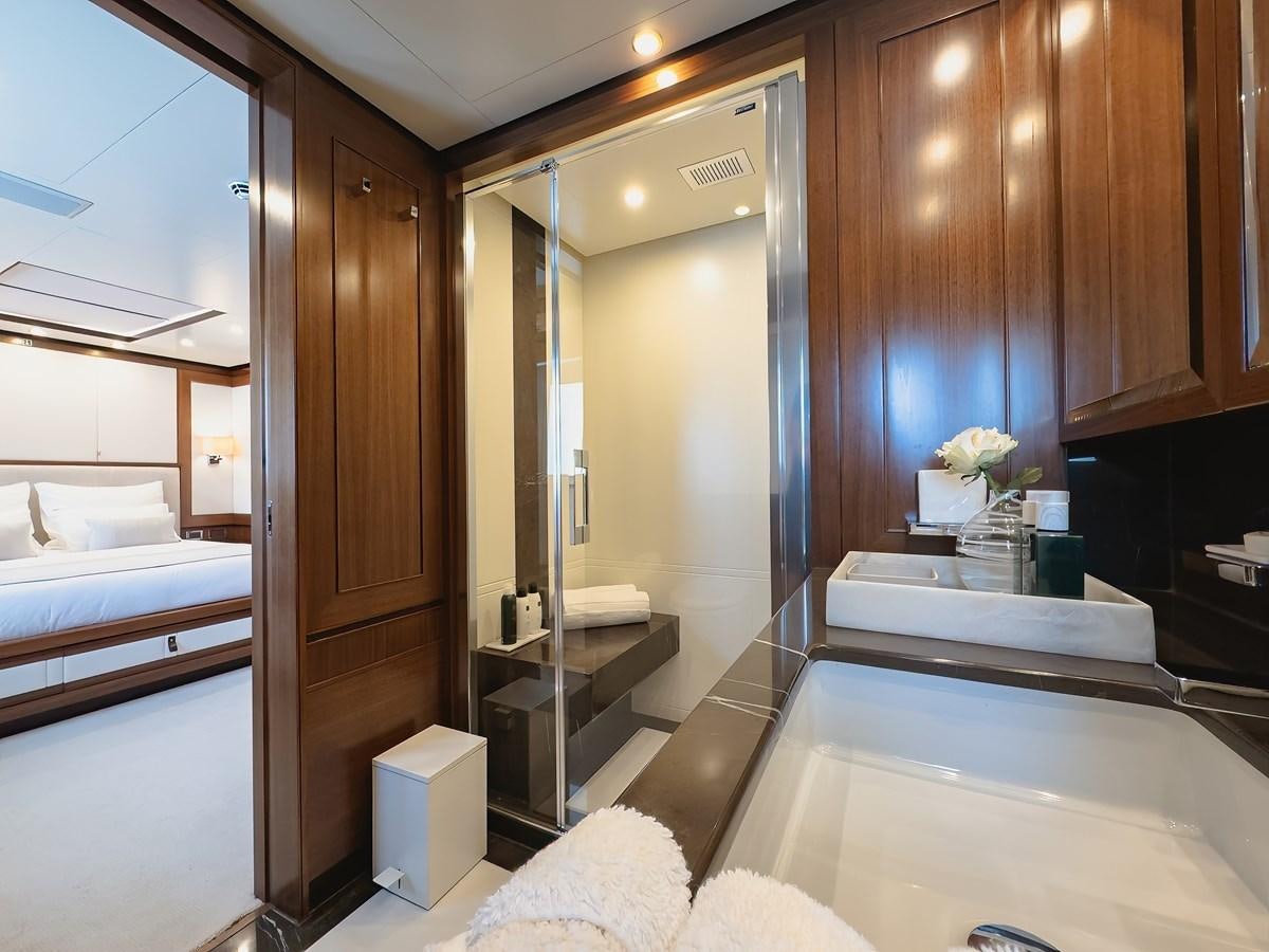 a bathroom with a large mirror aboard NEW WAVES Yacht for Sale
