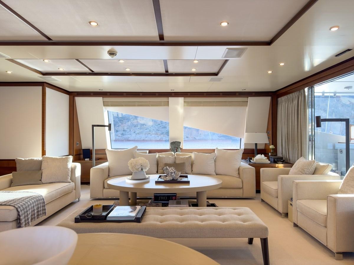 a living room with a large window aboard NEW WAVES Yacht for Sale