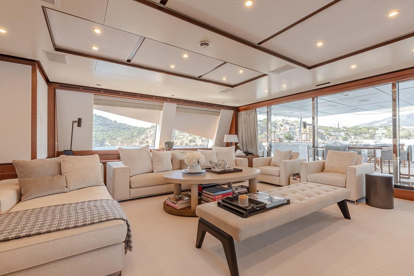 a living room with a large window aboard NEW WAVES Yacht for Sale