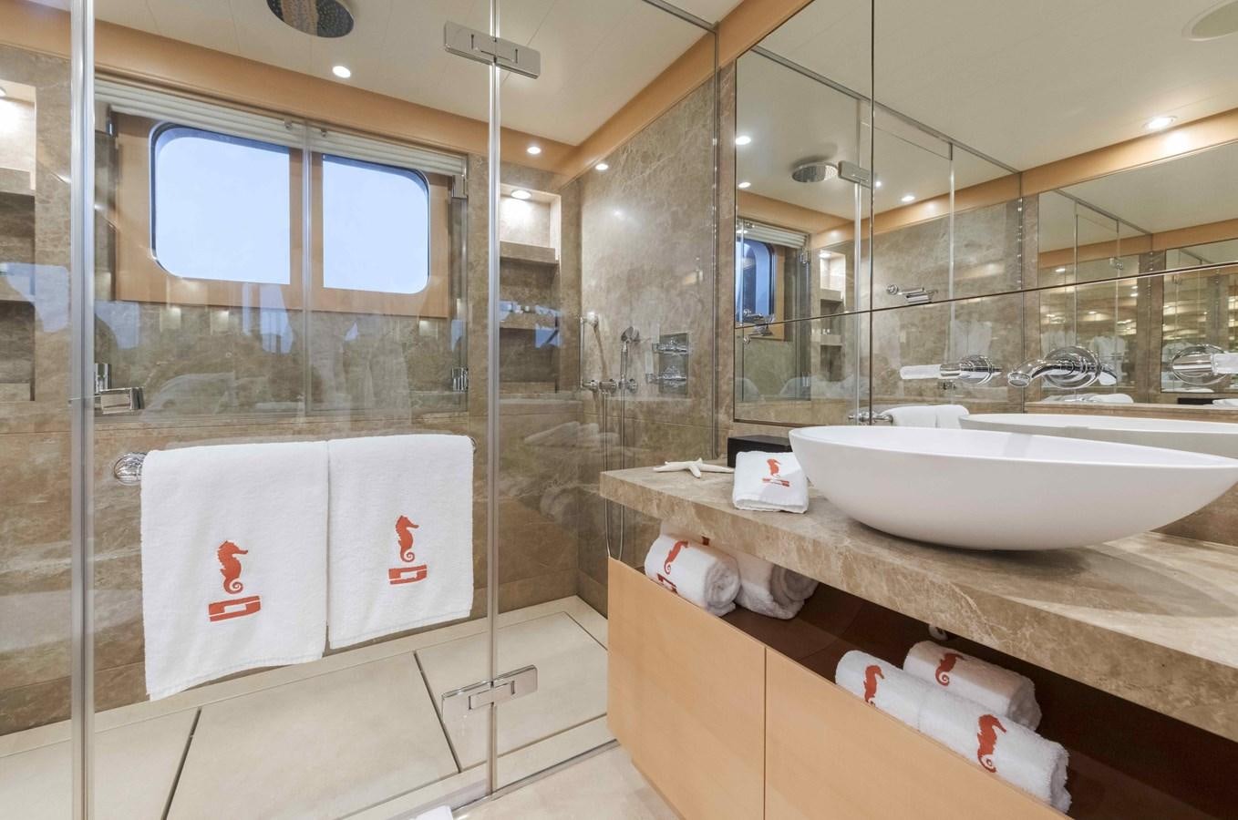 a bathroom with a large mirror aboard SPIRIT Yacht for Sale