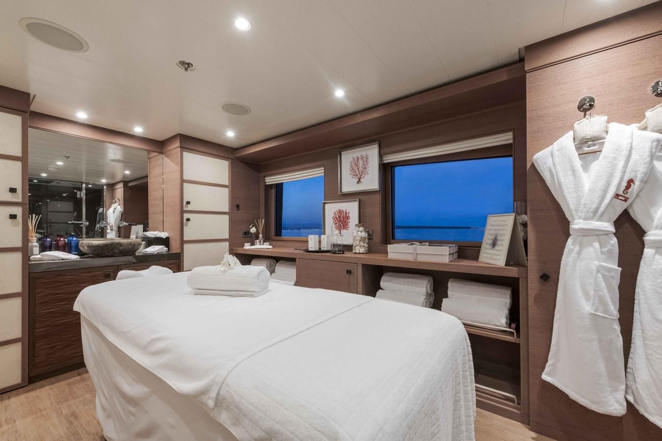 a bedroom with a bed and a television aboard SPIRIT Yacht for Sale