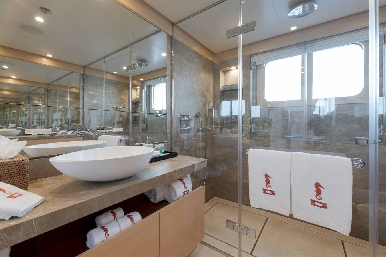 a bathroom with a glass shower aboard SPIRIT Yacht for Sale