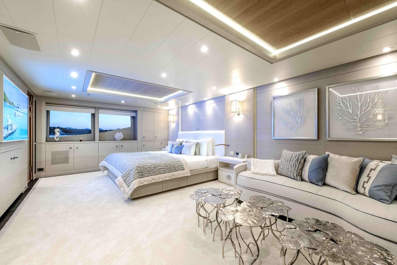 a bedroom with a bed and a tv aboard SPIRIT Yacht for Sale