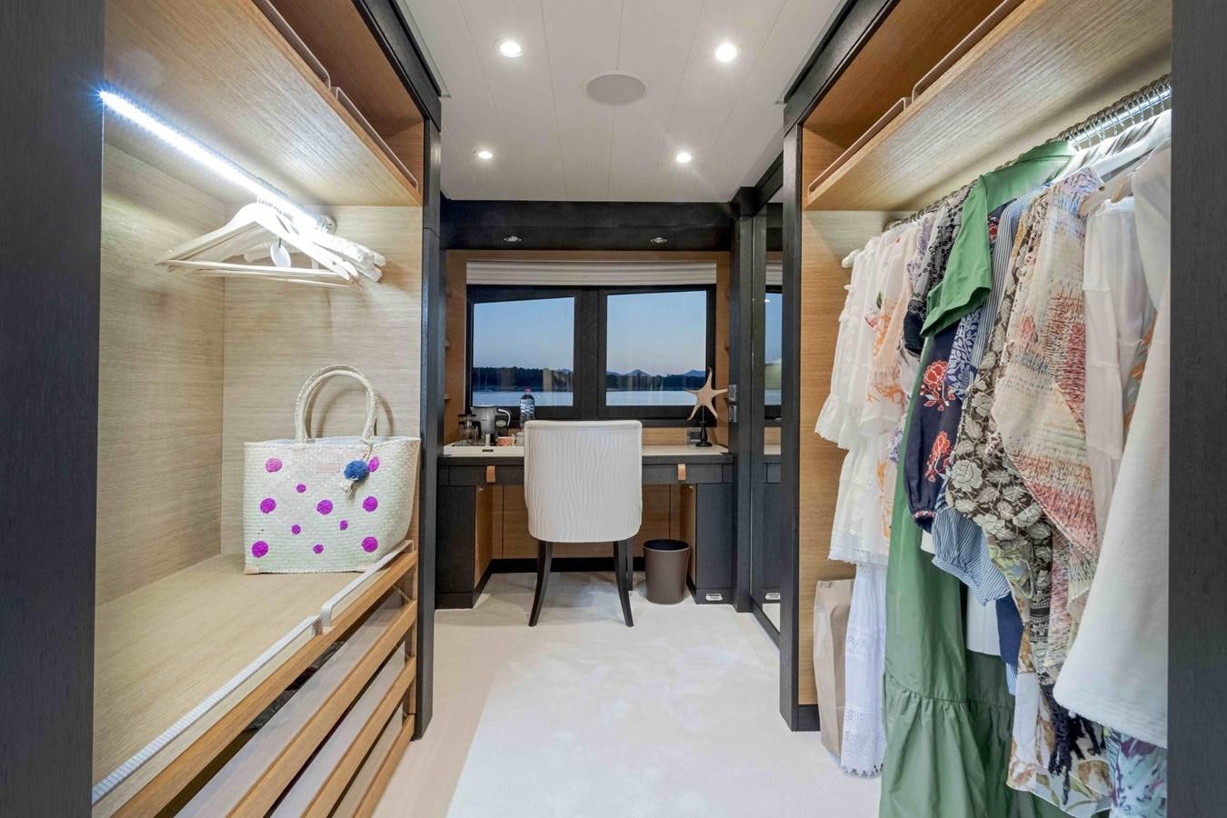 a room with a desk and a chair aboard SPIRIT Yacht for Sale