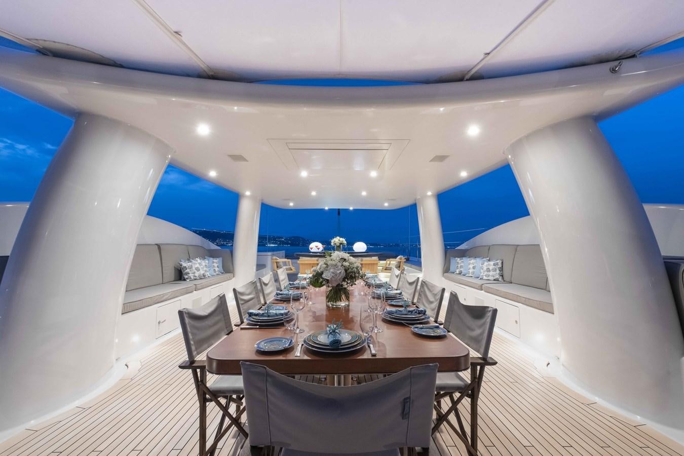 a room with a table and chairs aboard SPIRIT Yacht for Sale