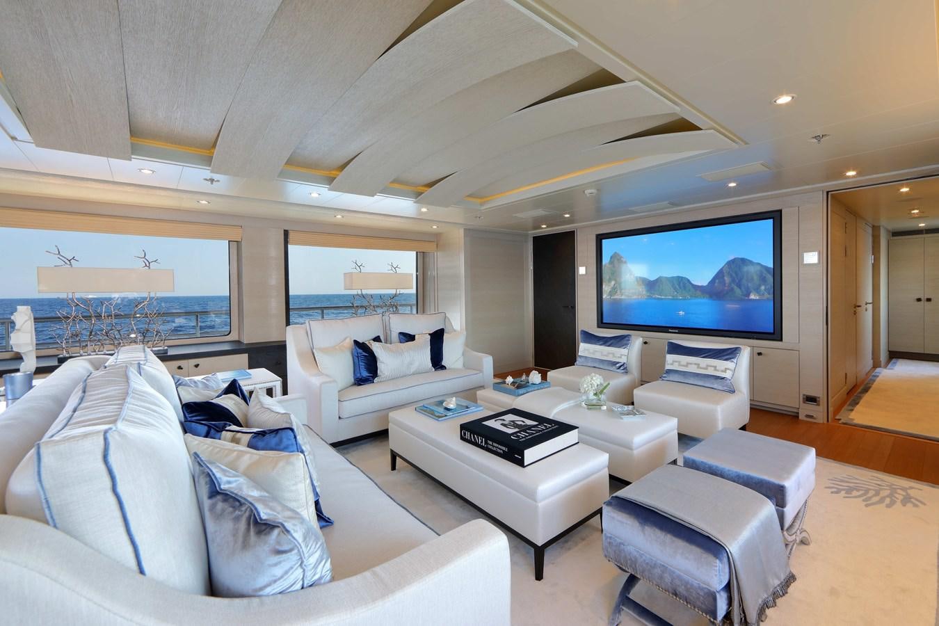 a living room with a large screen aboard SPIRIT Yacht for Sale