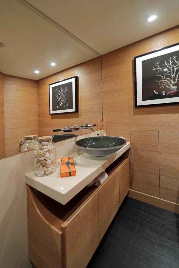 a bathroom with a sink and a mirror aboard SPIRIT Yacht for Sale