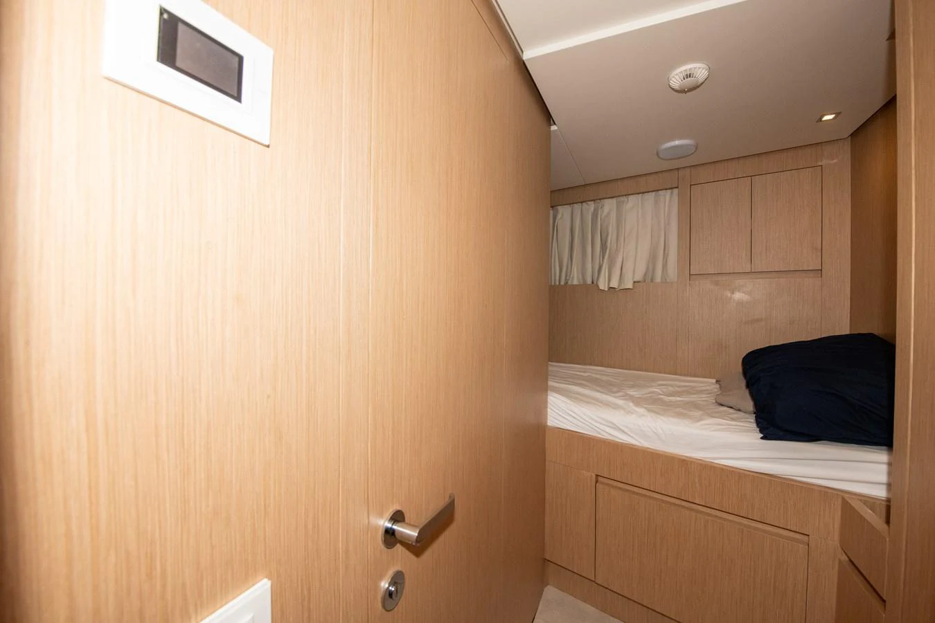 a room with a bed and a closet aboard OUR ALEPH Yacht for Sale