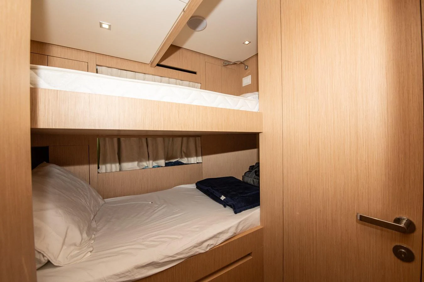 a room with a bed and a closet aboard OUR ALEPH Yacht for Sale