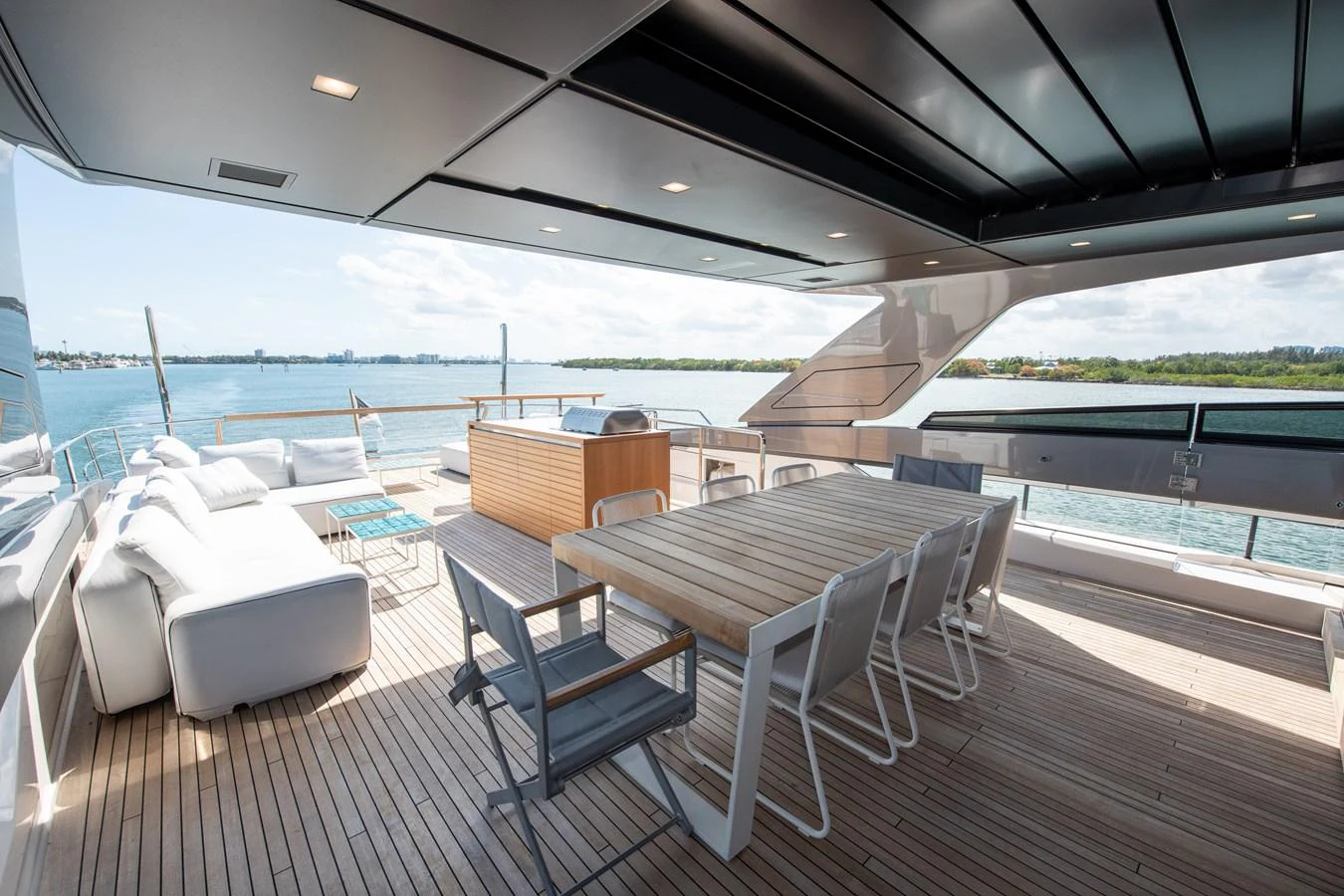 a deck with chairs and tables on it aboard OUR ALEPH Yacht for Sale