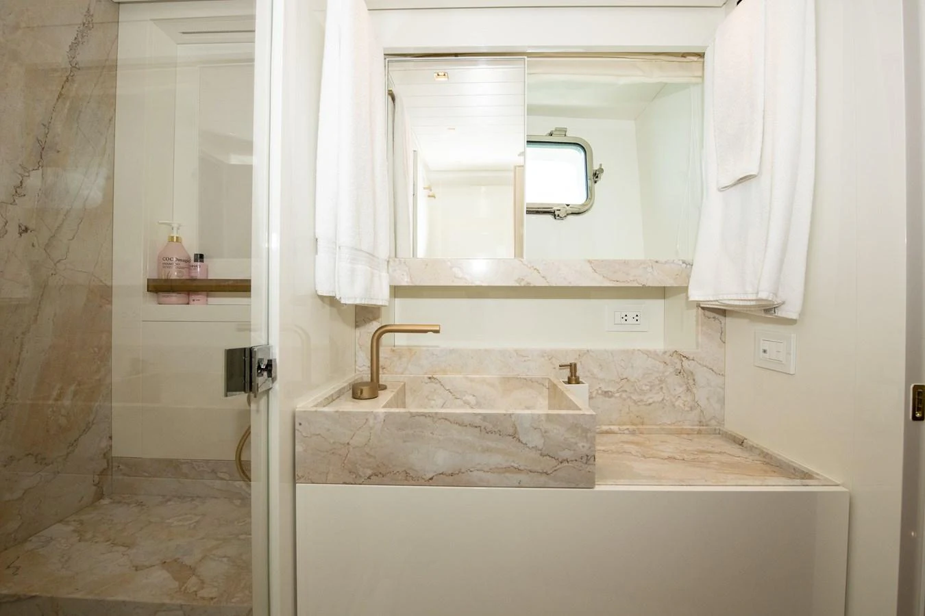 a bathroom with a sink and a mirror aboard OUR ALEPH Yacht for Sale