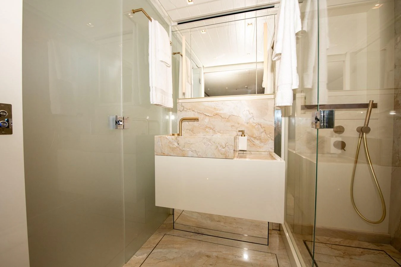 a bathroom with a tub and shower aboard OUR ALEPH Yacht for Sale