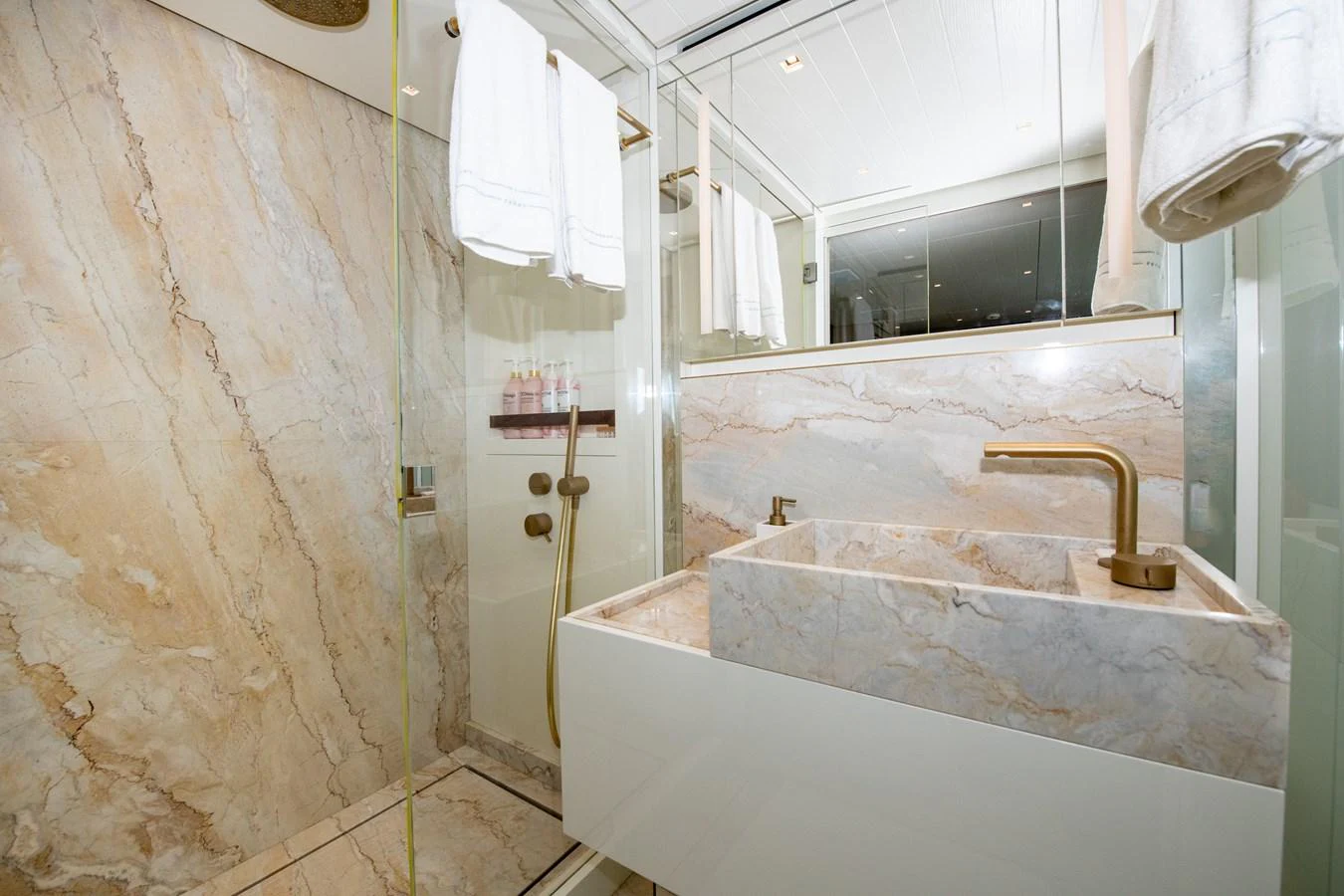 a bathroom with a sink and a bathtub aboard OUR ALEPH Yacht for Sale