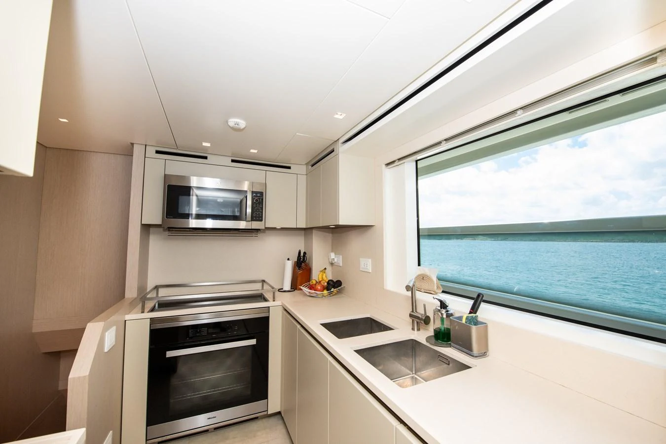 a kitchen with a window aboard OUR ALEPH Yacht for Sale