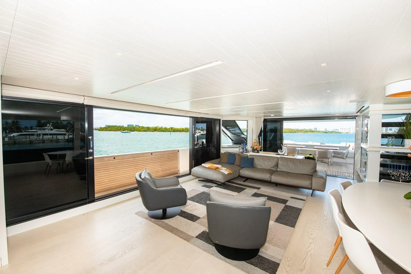 a living room with a large window aboard OUR ALEPH Yacht for Sale