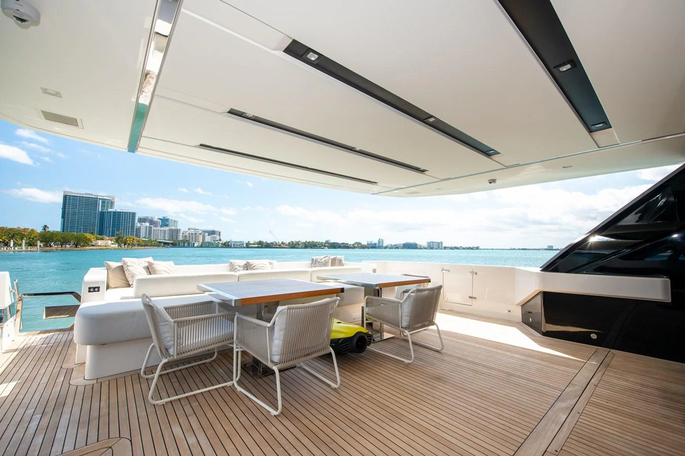 a room with a table chairs and a large body of water aboard OUR ALEPH Yacht for Sale