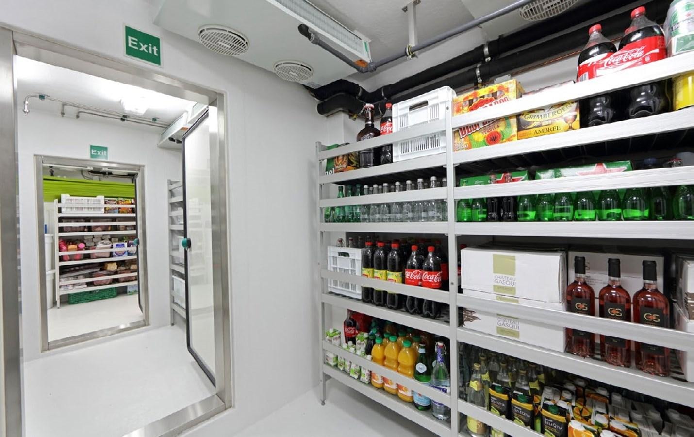 a fridge with shelves of drinks aboard YERSIN Yacht for Sale