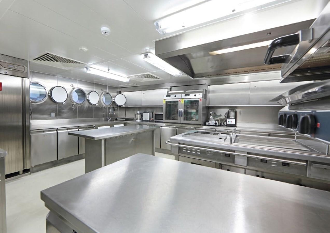 a large kitchen with stainless steel appliances aboard YERSIN Yacht for Sale