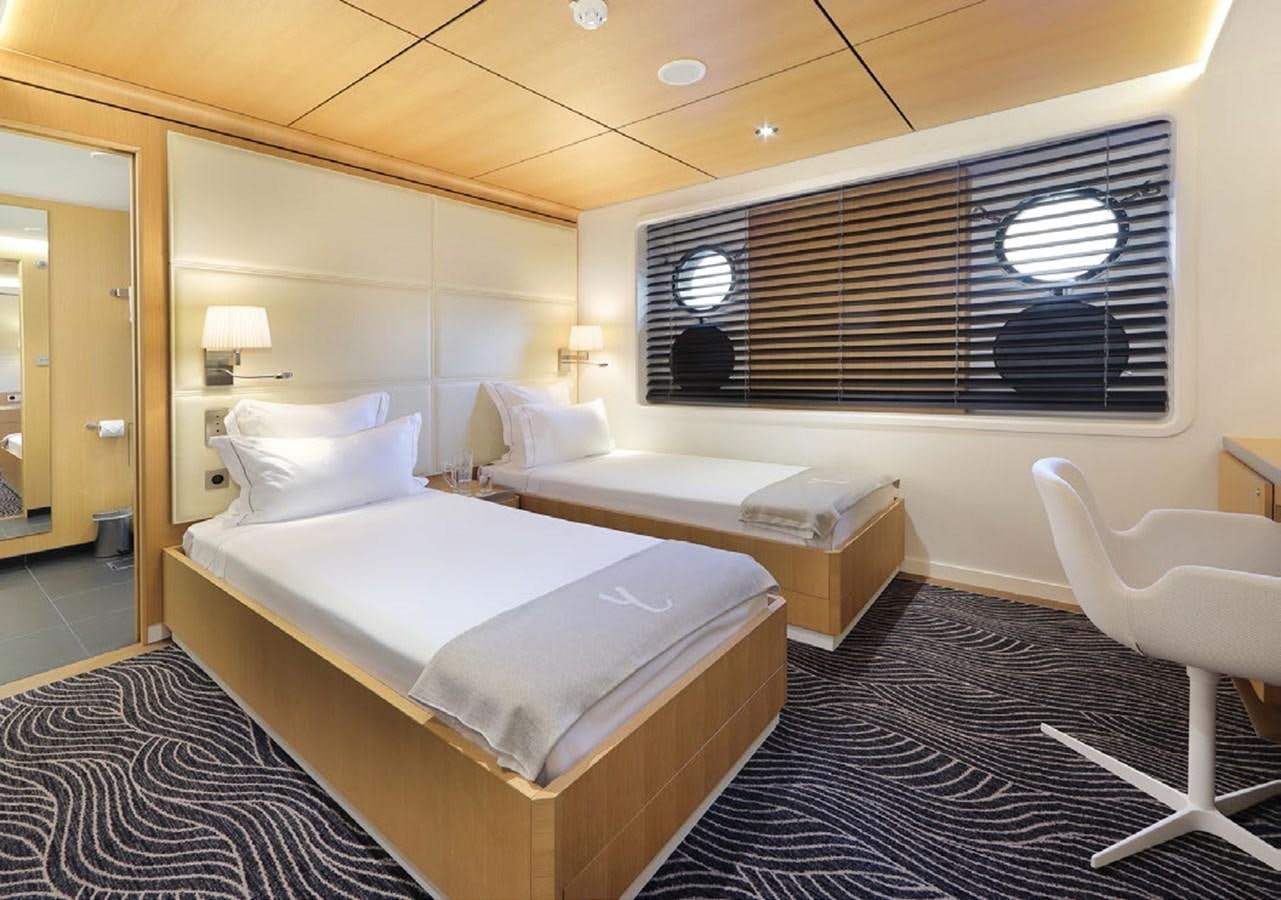 a room with two beds aboard YERSIN Yacht for Sale