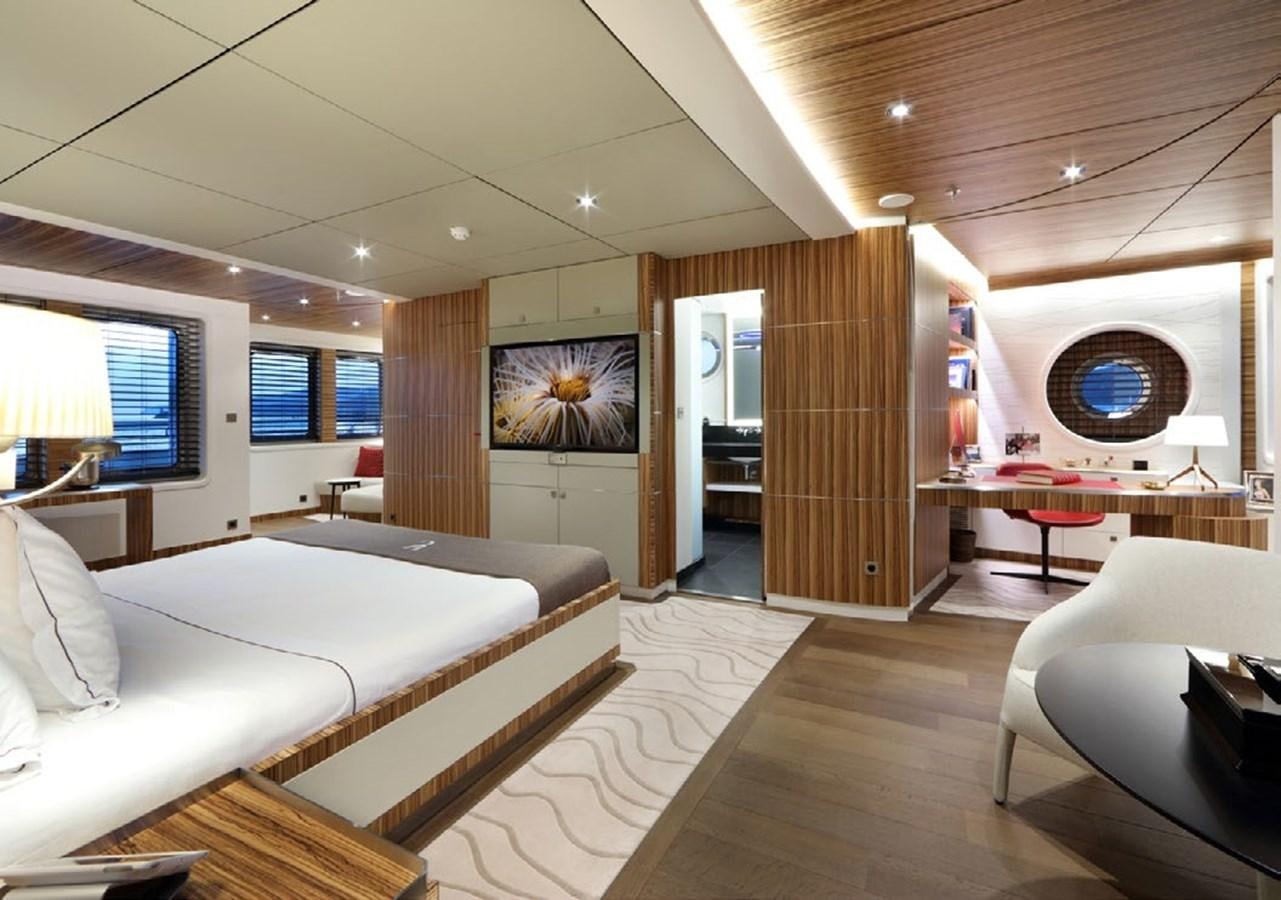 a room with a bed and a desk aboard YERSIN Yacht for Sale