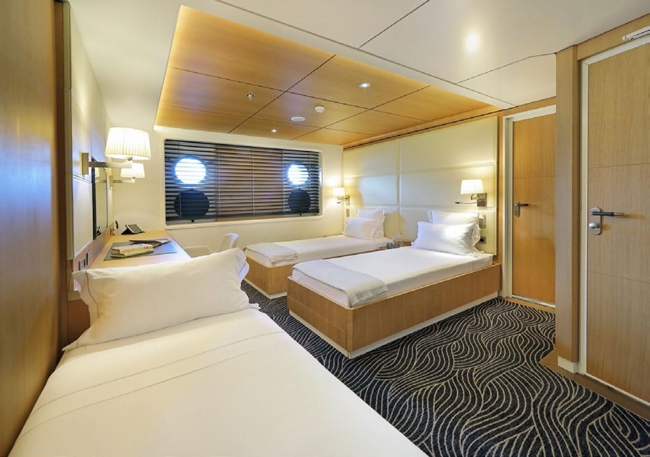a room with a couple of beds aboard YERSIN Yacht for Sale