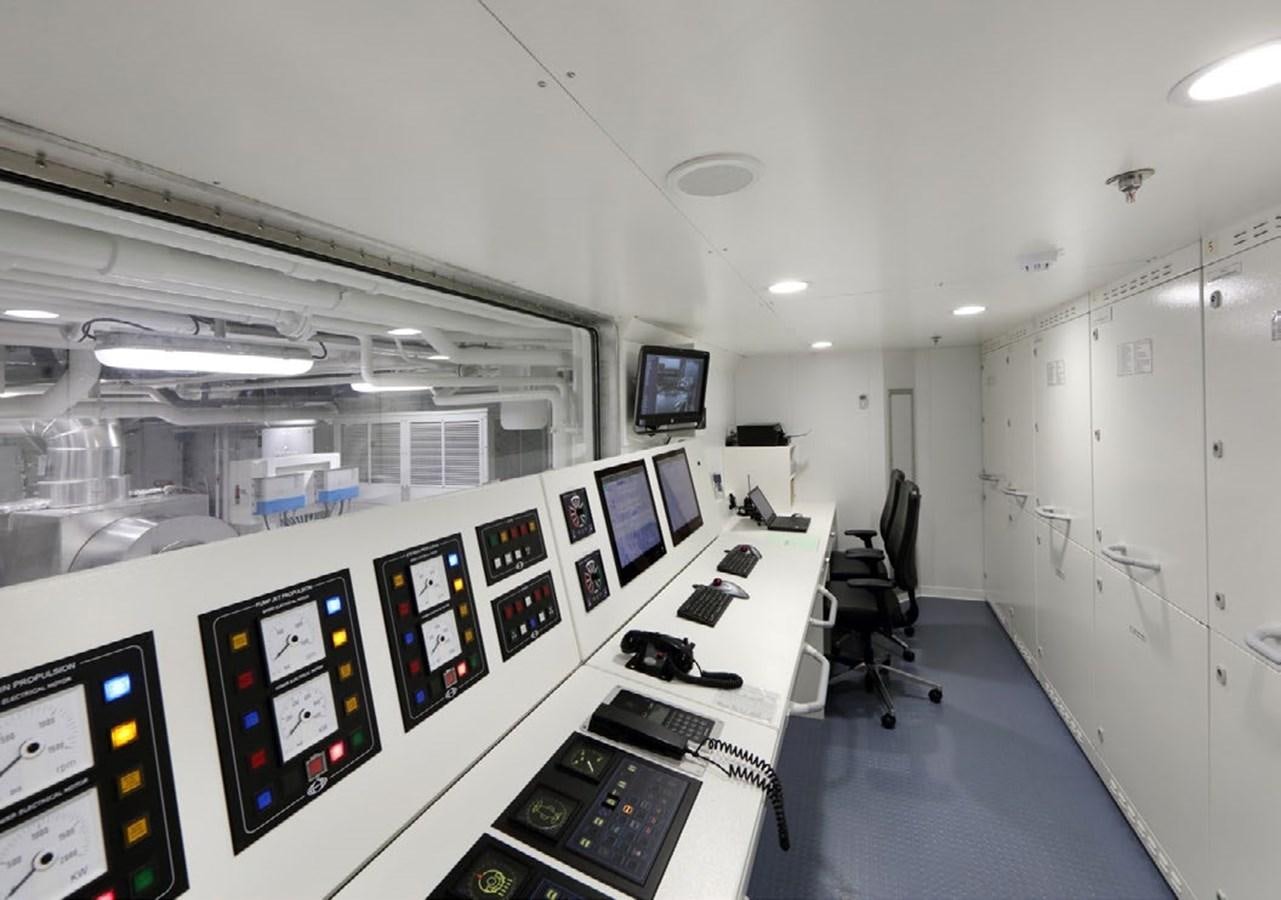 a room with computers and monitors aboard YERSIN Yacht for Sale