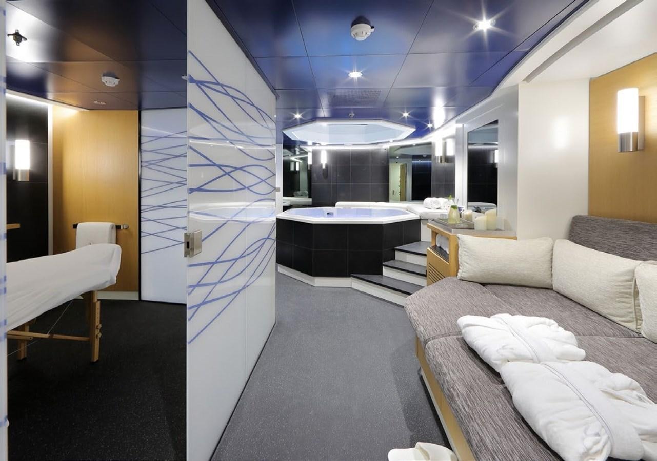 a room with a bed and a large glass wall aboard YERSIN Yacht for Sale