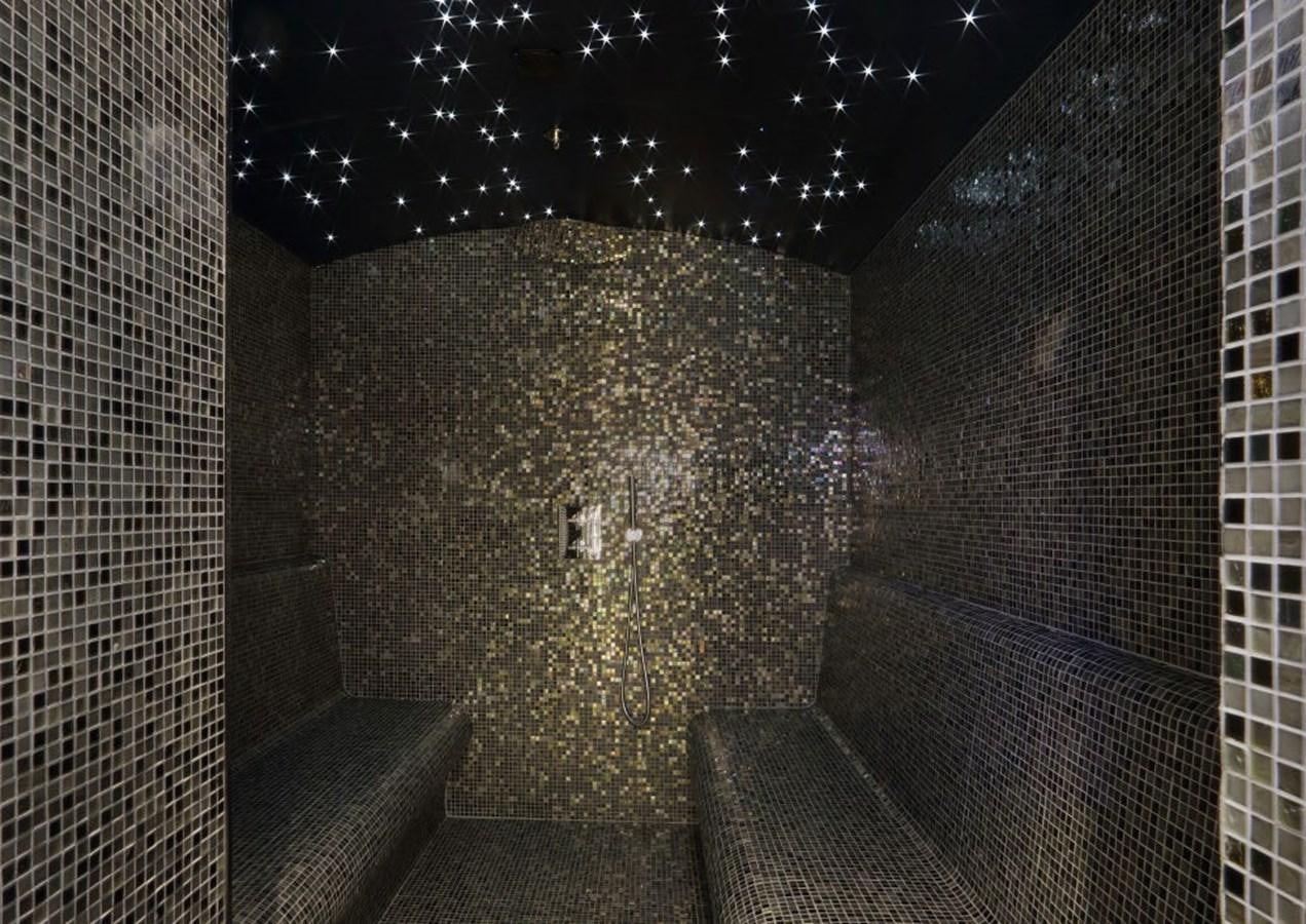 a stone tunnel with a light on it aboard YERSIN Yacht for Sale
