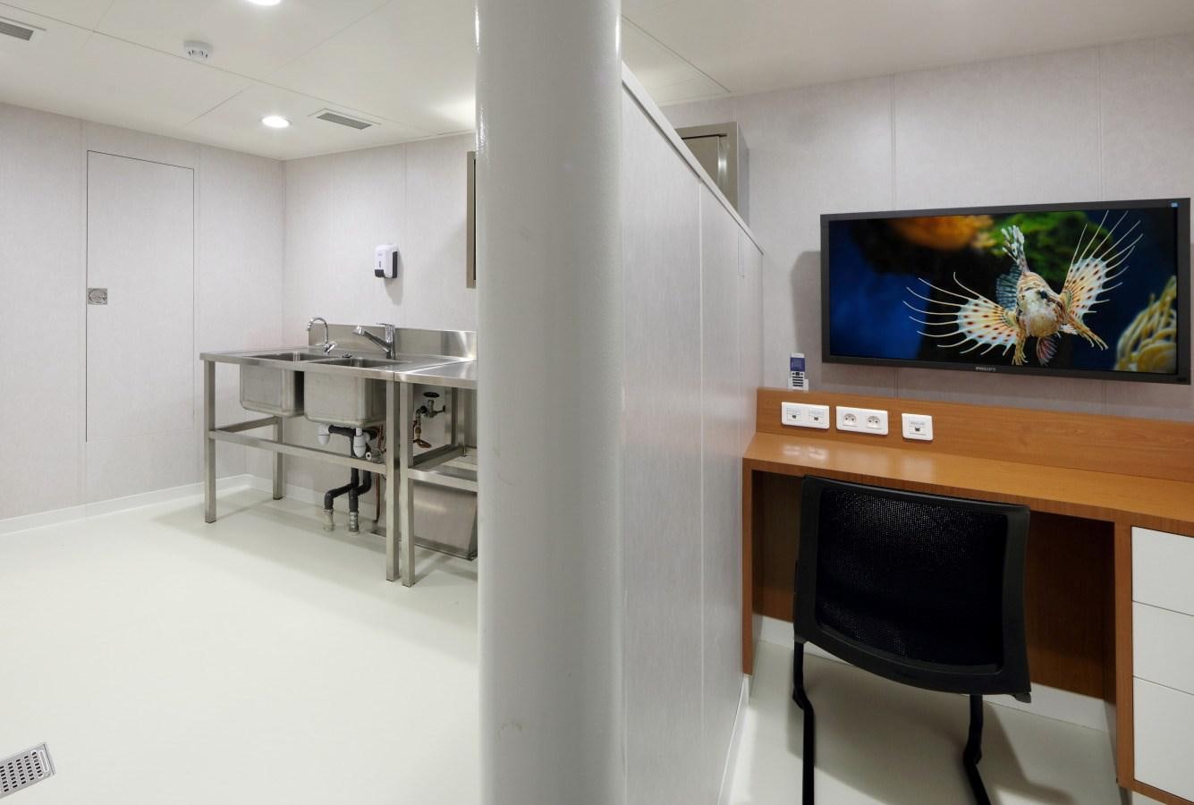 a tv on a stand in a room aboard YERSIN Yacht for Sale