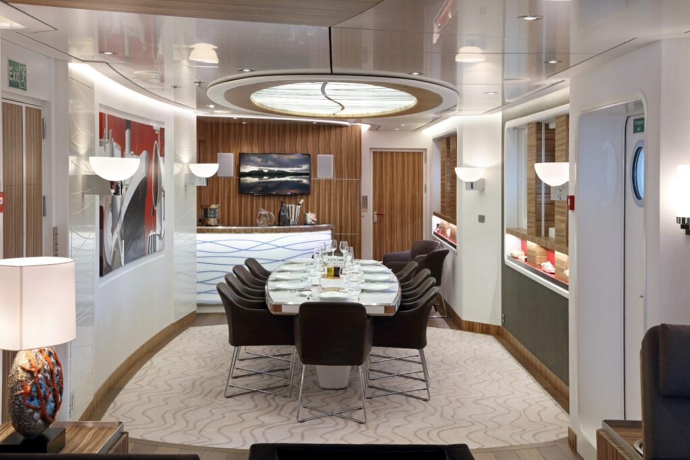 a dining room with a table and chairs aboard YERSIN Yacht for Sale