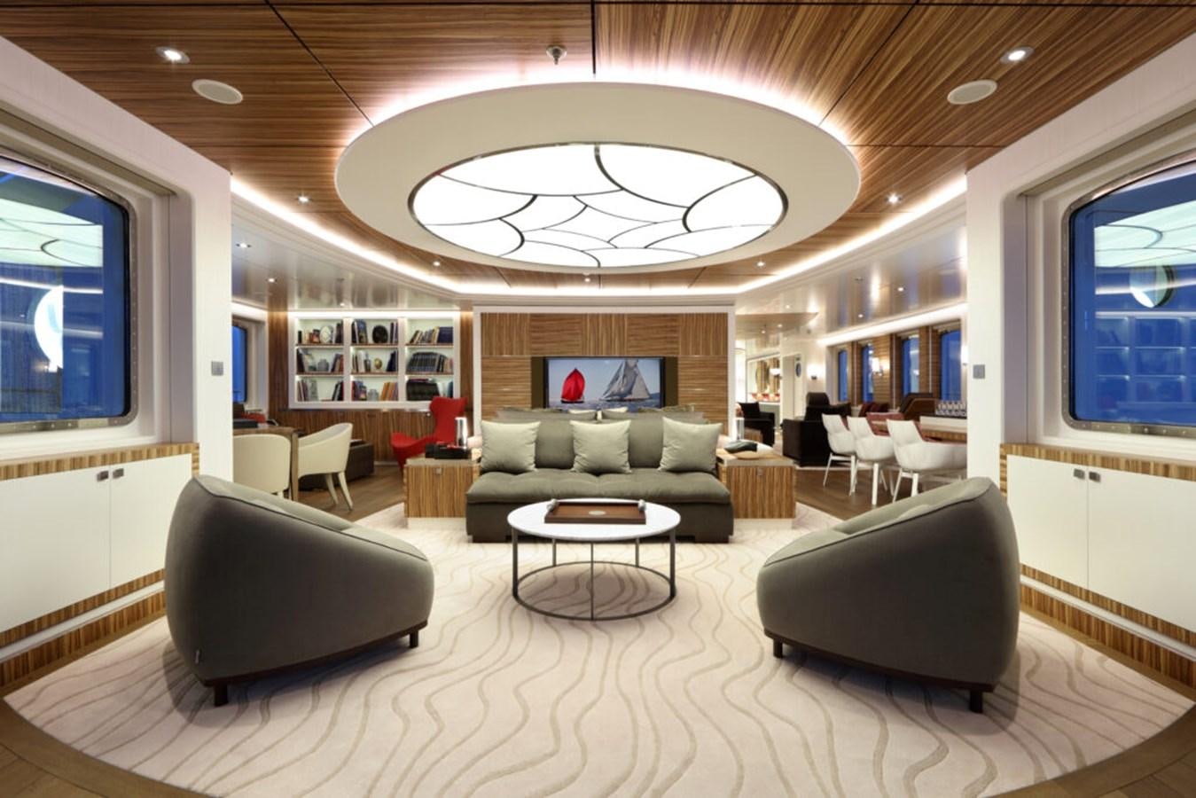 a large living room with a large chandelier aboard YERSIN Yacht for Sale