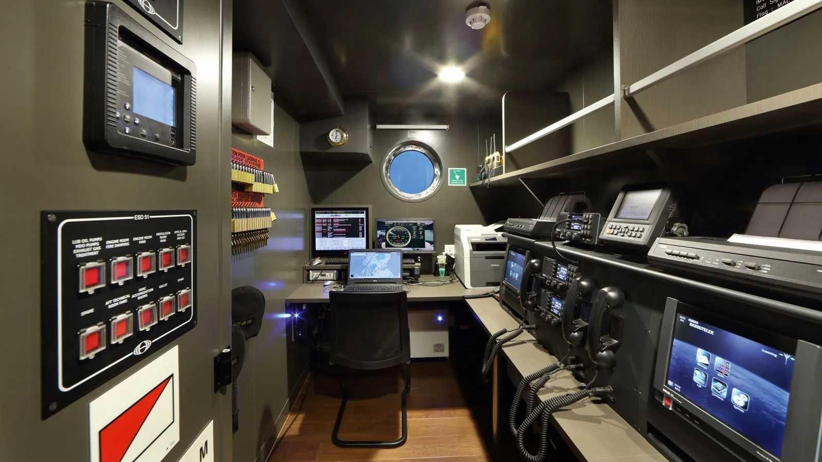 a room with computers and monitors aboard YERSIN Yacht for Sale