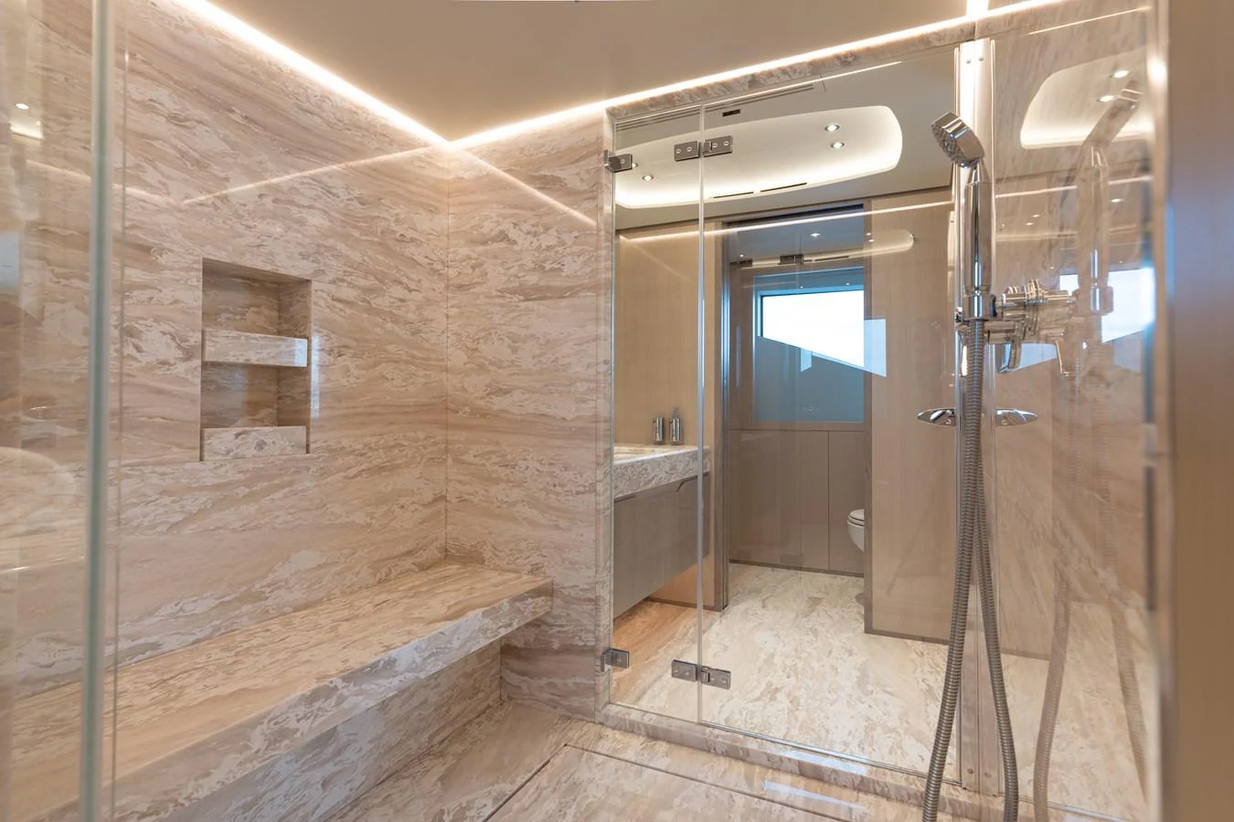 a bathroom with a glass shower aboard ABBENTURES III Yacht for Sale