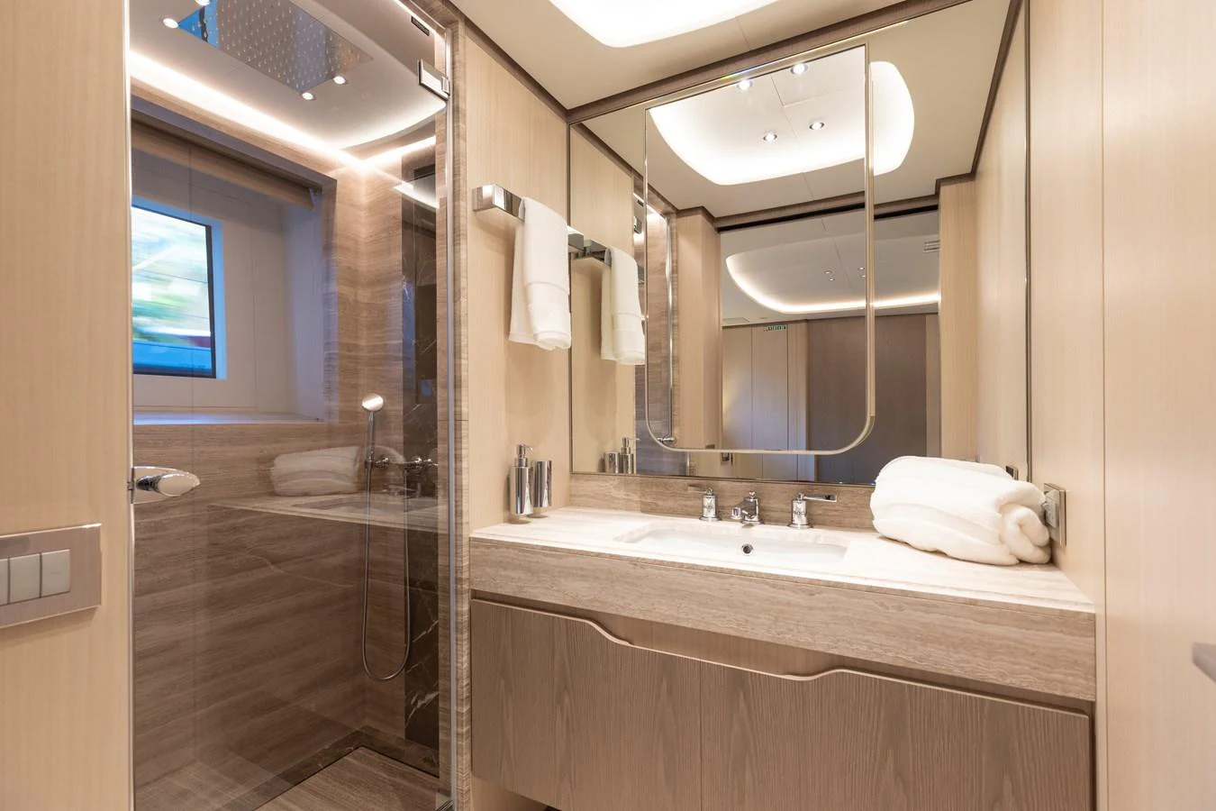 a bathroom with a large mirror aboard ABBENTURES III Yacht for Sale