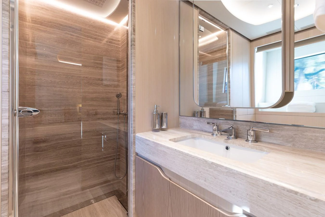 a bathroom with a sink and a mirror aboard ABBENTURES III Yacht for Sale