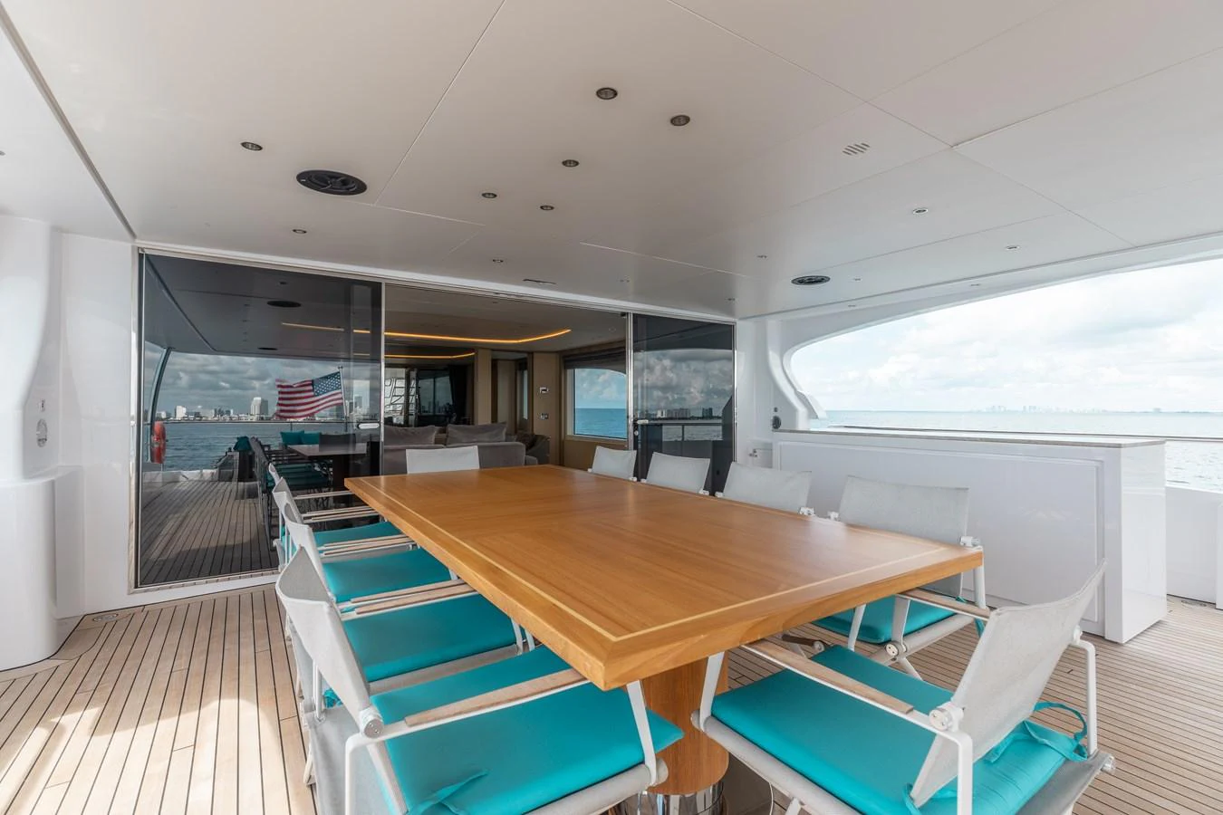 a room with a table and chairs aboard ABBENTURES III Yacht for Sale