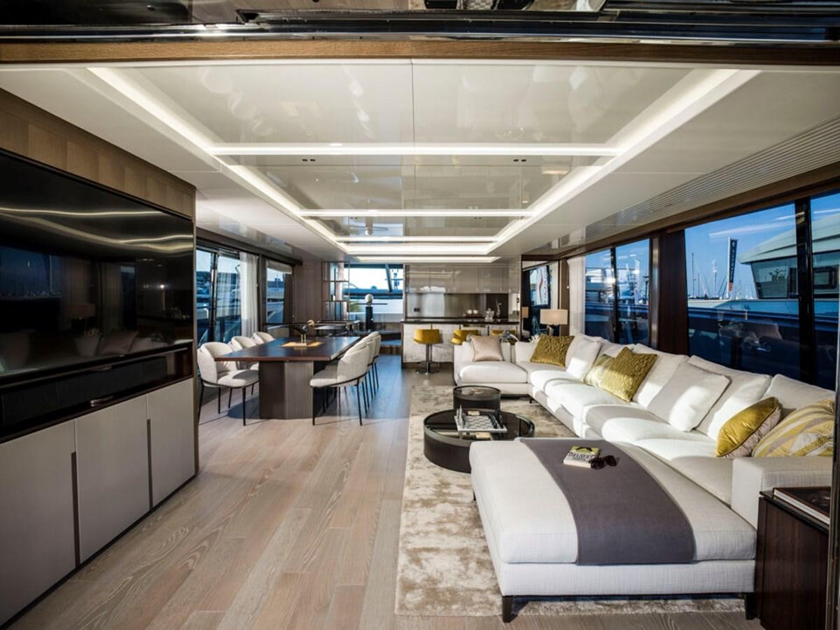 a room with couches and a table aboard 90 OCEAN Yacht for Sale