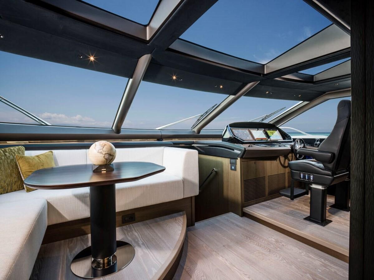 a table and chairs on a deck aboard 90 OCEAN Yacht for Sale