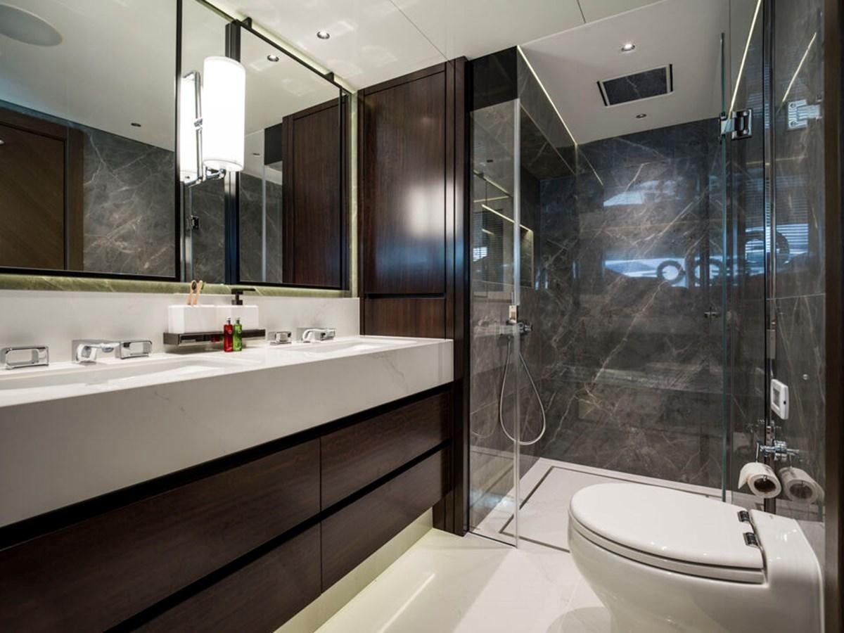 a bathroom with a glass shower aboard 90 OCEAN Yacht for Sale