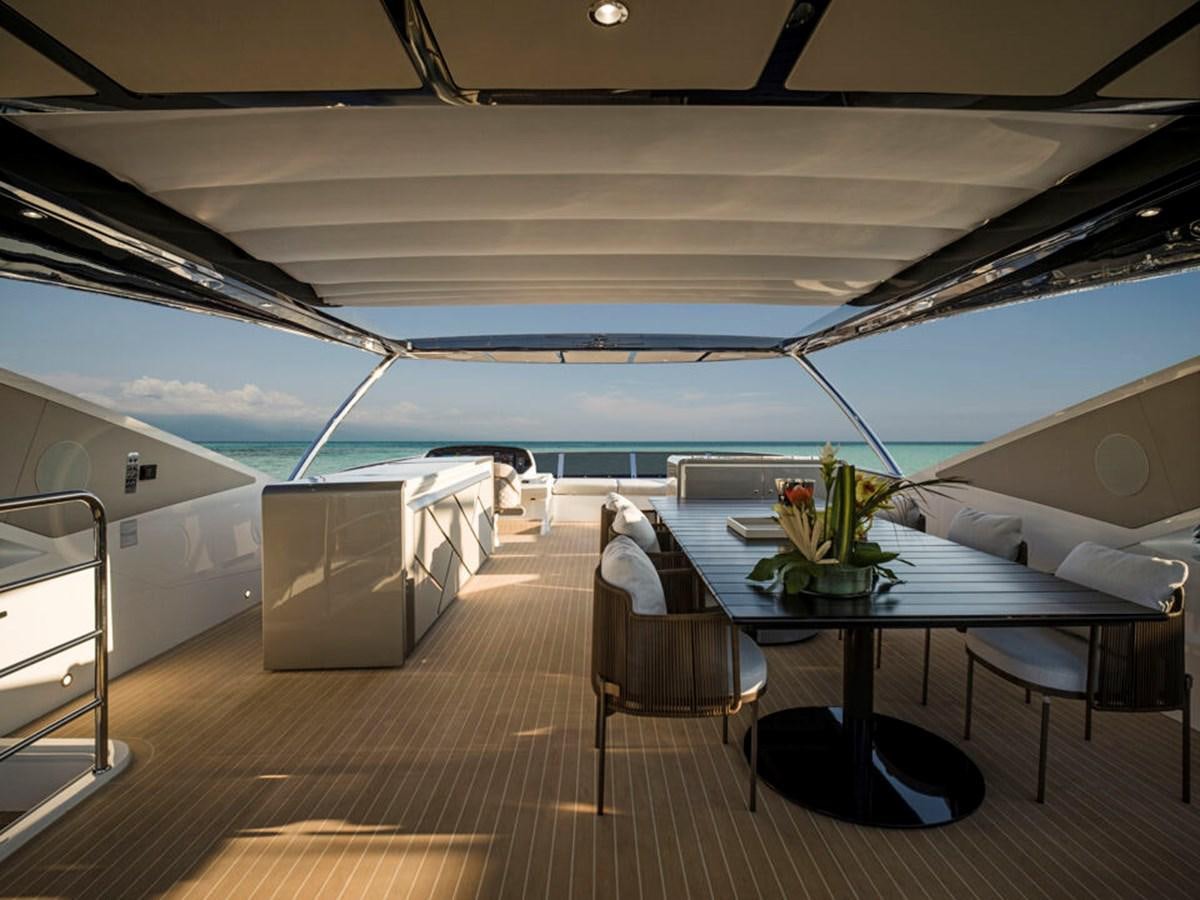 a room with a table and chairs aboard 90 OCEAN Yacht for Sale