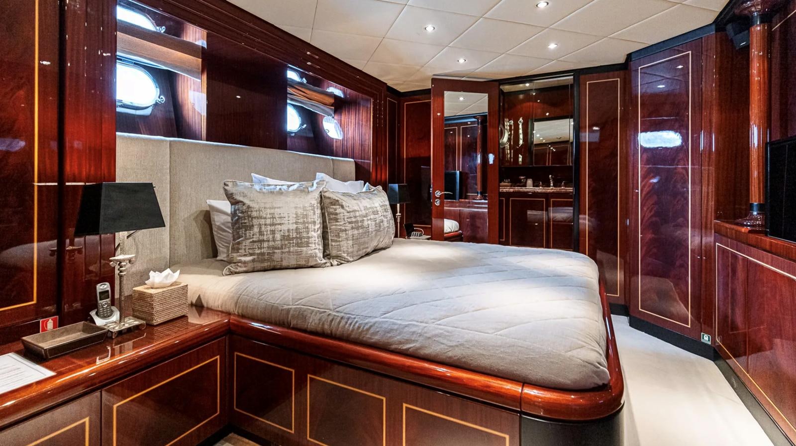 a bed in a room aboard SVEA Yacht for Sale