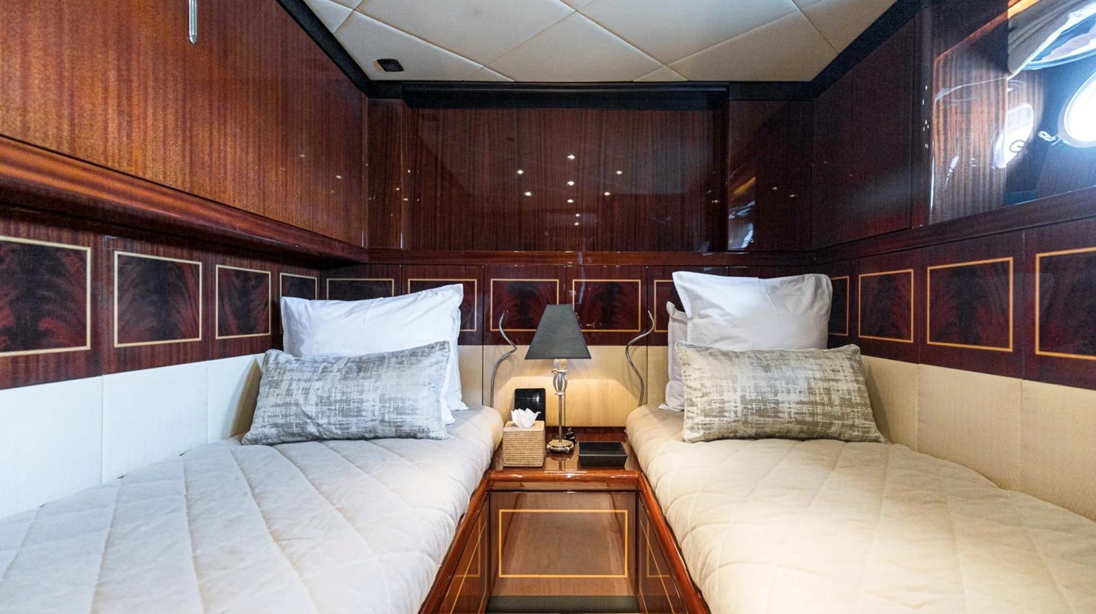 a room with two beds aboard SVEA Yacht for Sale